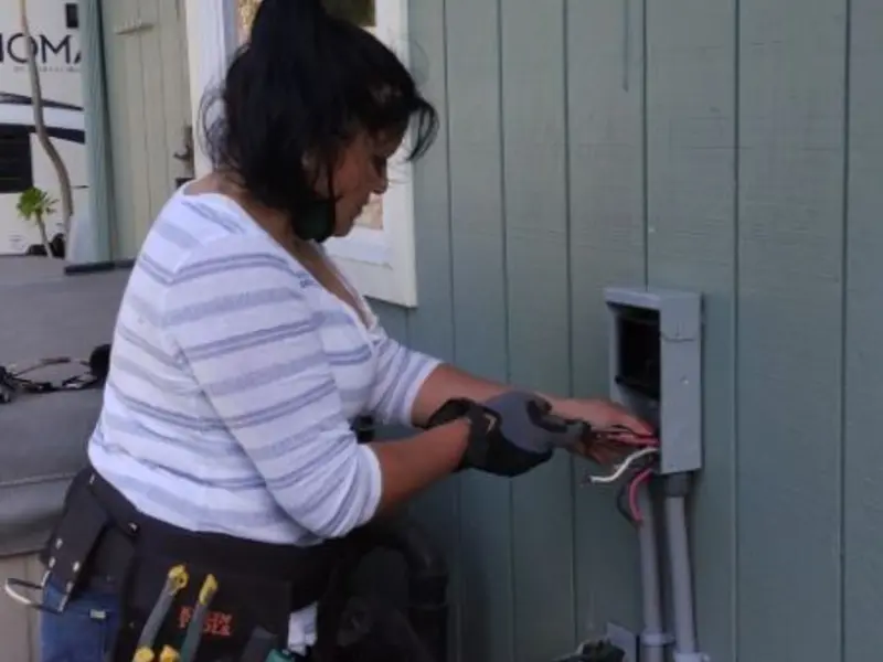 Licensed electrician wiring an exterior subpanel in Lower Towamensing