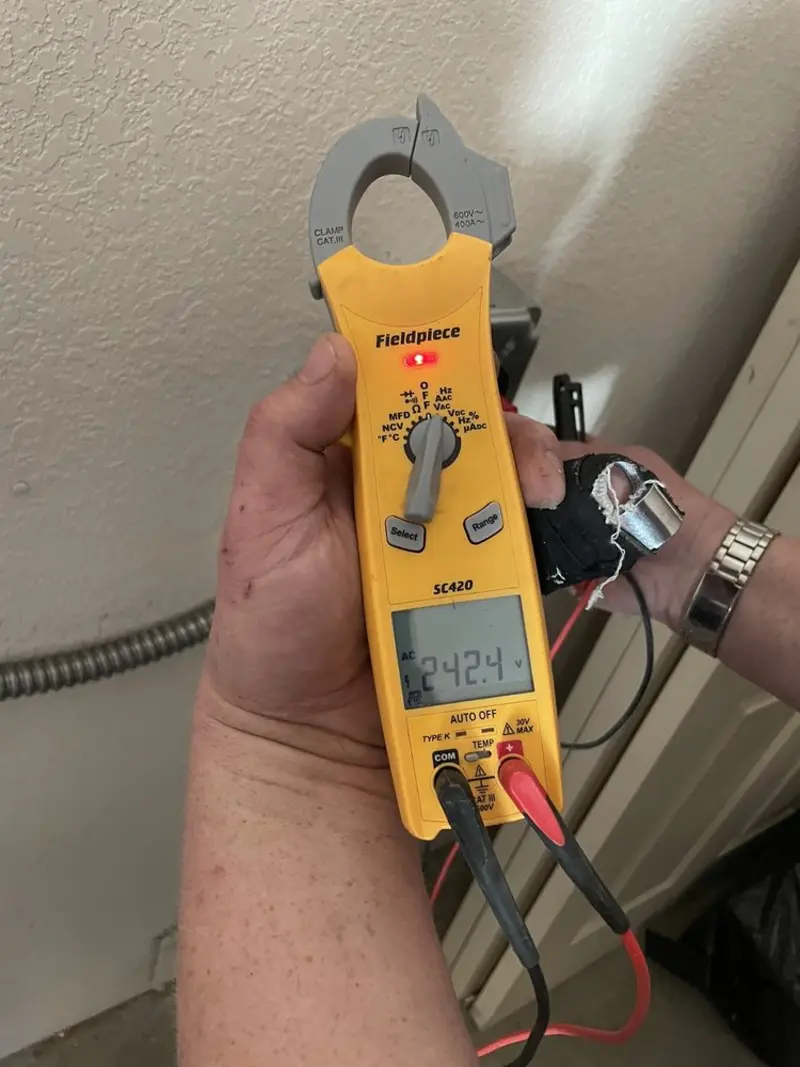 Voltage testing with clamp meter during Electrical Installation Services in Lower Towamensing